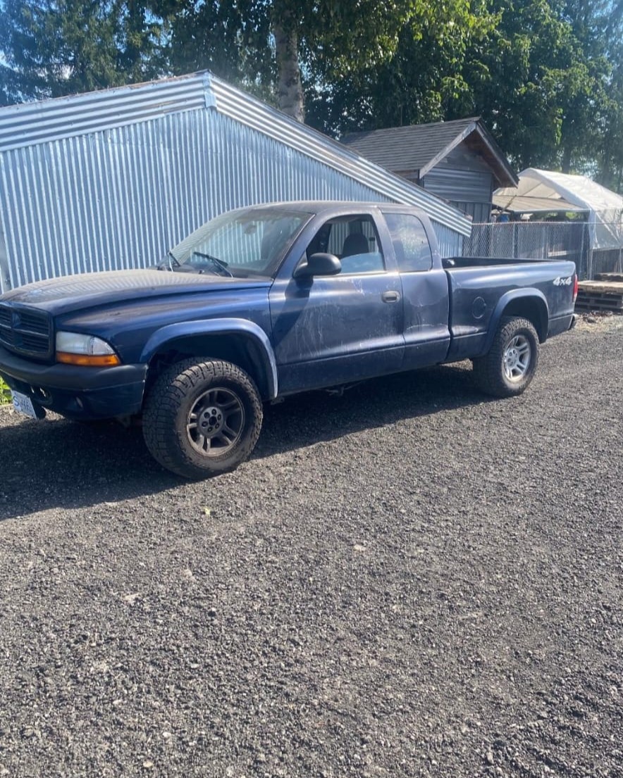 Scrap car removal truck picking up a vehicle in Abbotsford